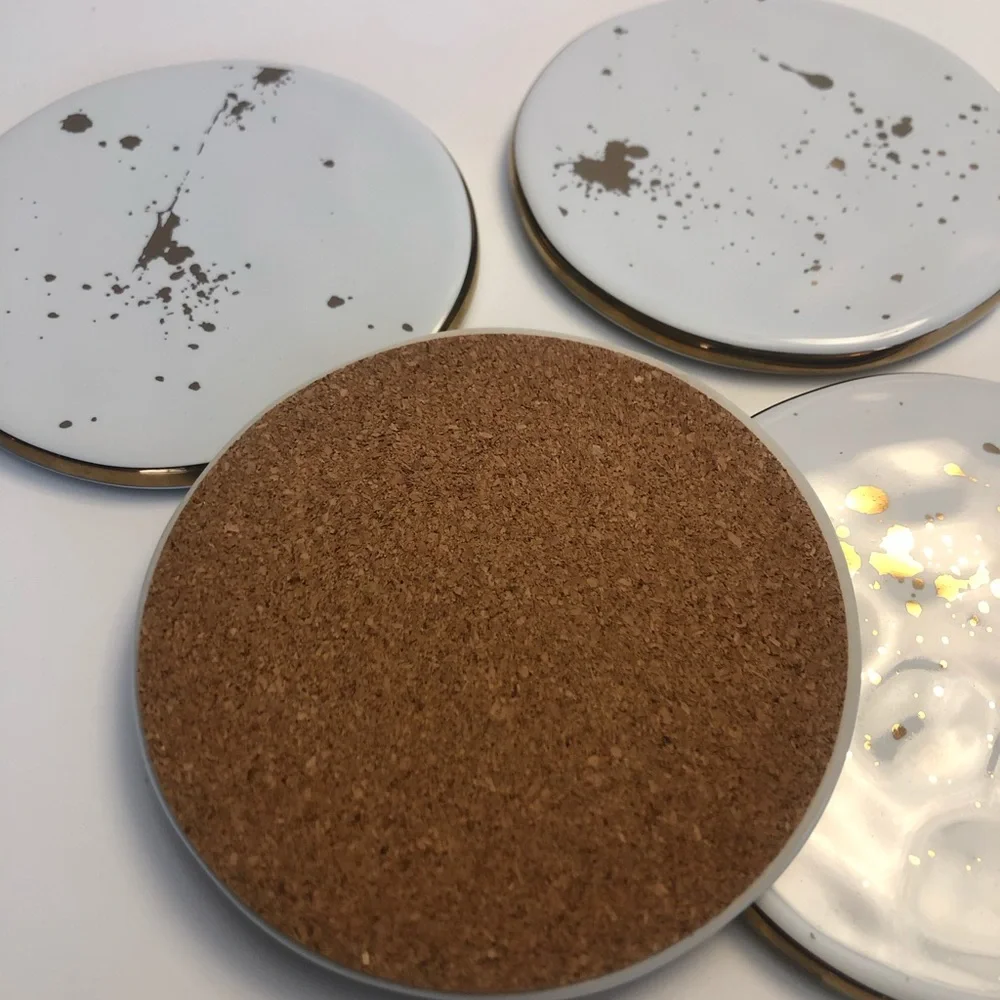Ceramic coasters with gold trim and gold flecks